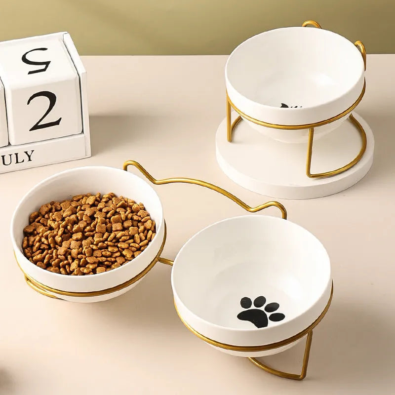 White ceramic cat bowl with cat footprints pattern on black iron frame