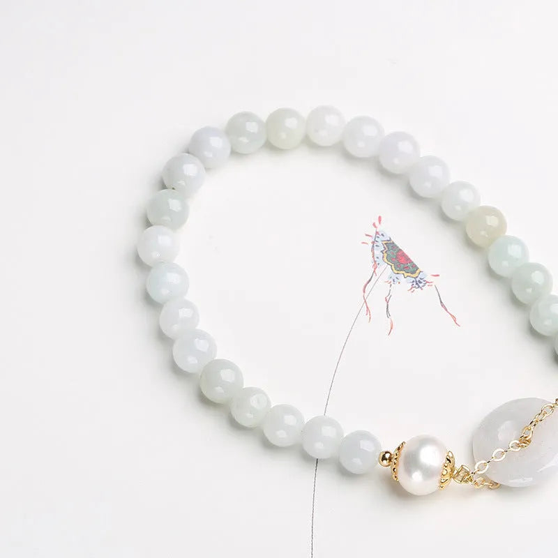 Handcrafted jade peace buckle bracelet with geometry design, round pendant, and national style elements