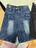 Man wearing loose light blue washed denim cowboy shorts with a straight-leg cut.
