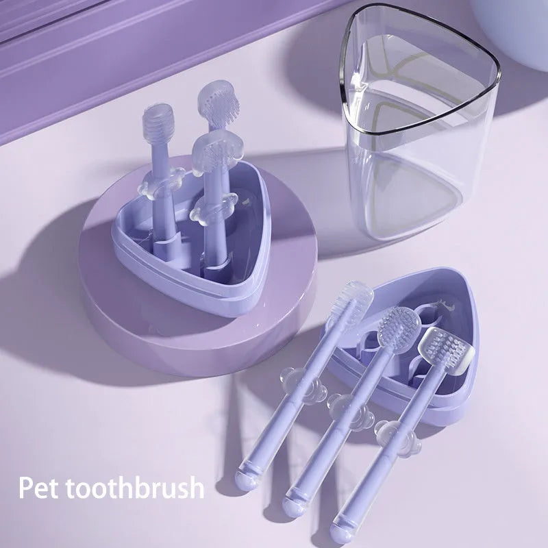 Purple soft silicone toothbrush for cleaning cat and dog teeth on a white background.