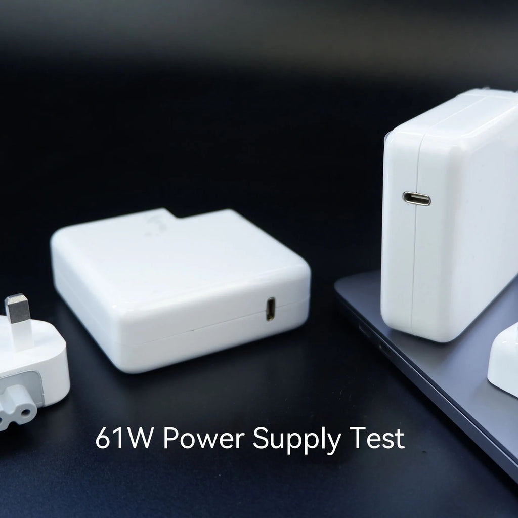 Compact square white laptop USB-C power adapter with optional international plug heads