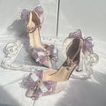 Purple satin women's wedding shoes with square toe and stiletto heel on white background