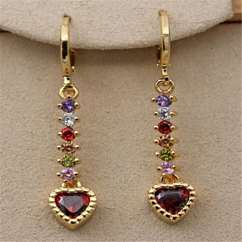 Gold and silver heart-shaped earrings with electroplated finish, showing front and back views