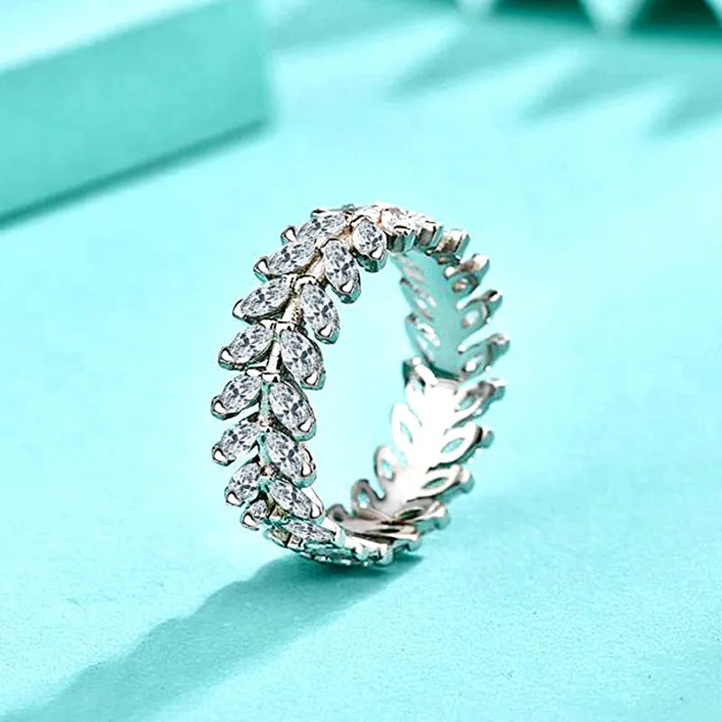 Silver closed ring for women with inlaid zircon stone, leaf shape and wheat detail in white gold colour, sizes 6 to 9