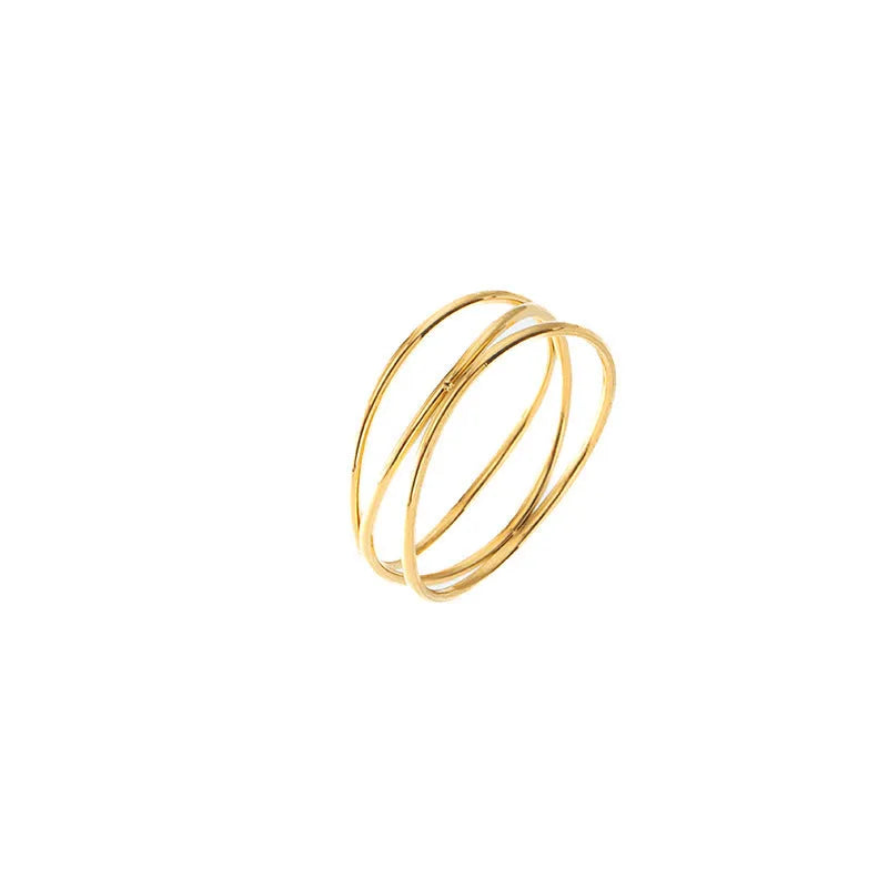 Gold-coloured geometric line ring with a three-layer coil design on a titanium steel band.
