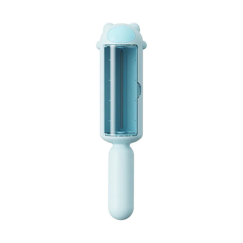 Blue pet hair remover with self-cleaning base rolling on a sofa to collect dog fur