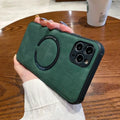 Black imitation leather magnetic charging case for iPhone on a magnetic charging puck