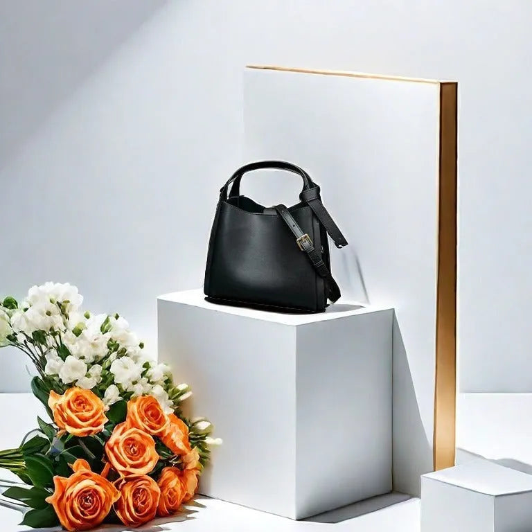 Women's tea brown genuine leather crossbody bucket bag showing internal zipped compartments