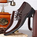 Men's black and brown formal business shoes with a square heel and round toe design on a rubber sole.