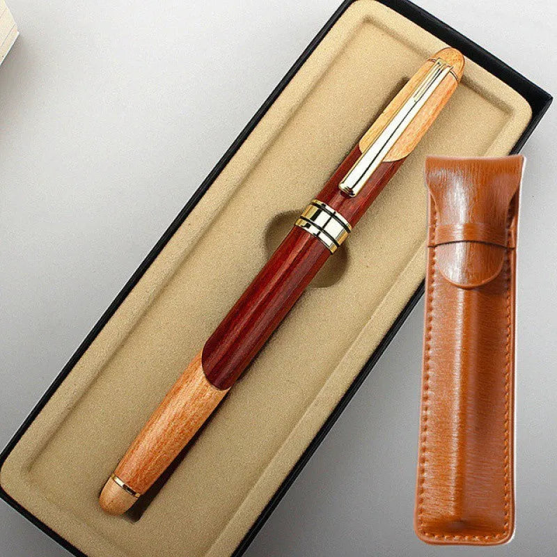 Wooden fountain pen with metal accents and a matching fabric pen bag.