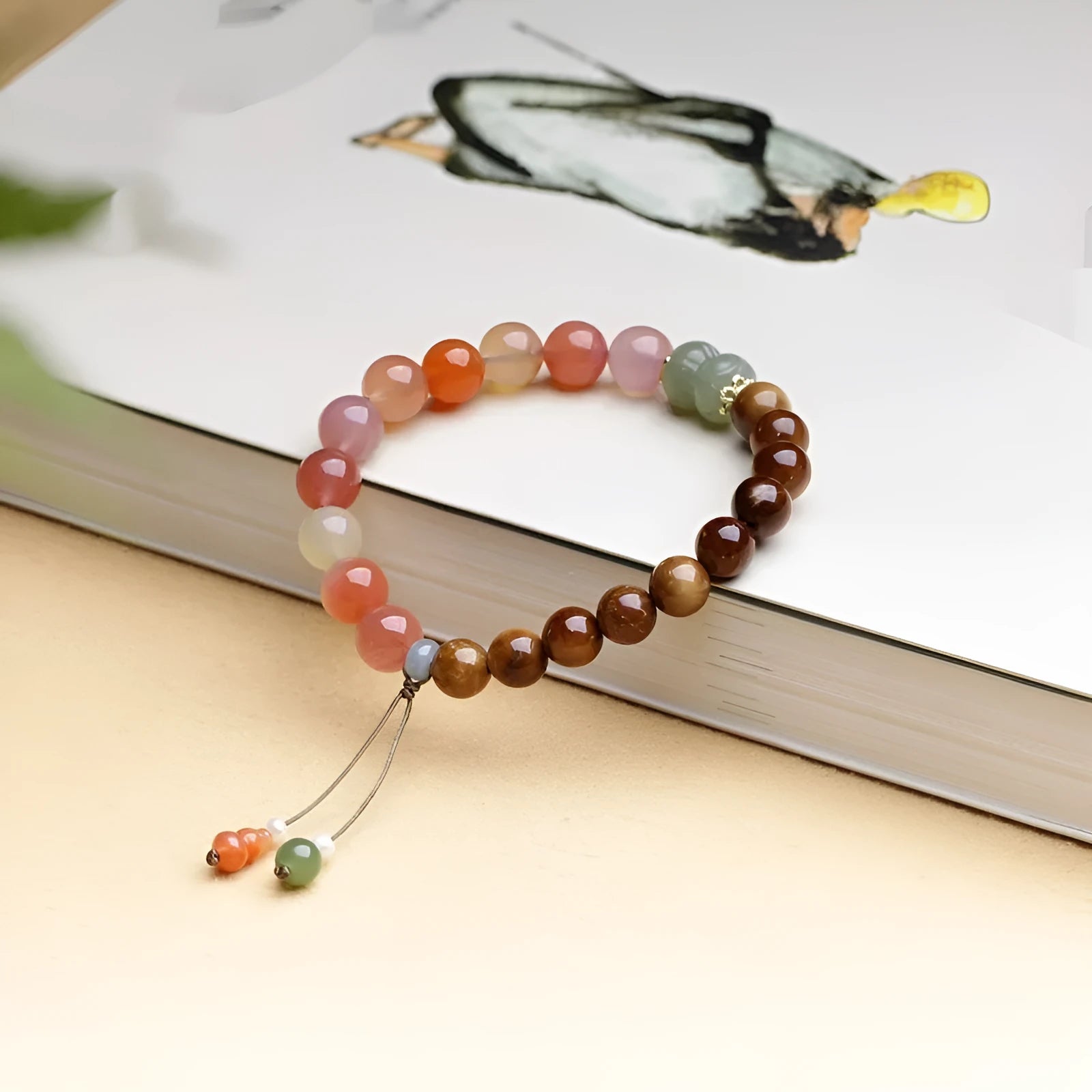 8mm agate bracelet with diamond-cut beads showing natural persimmon colour variations