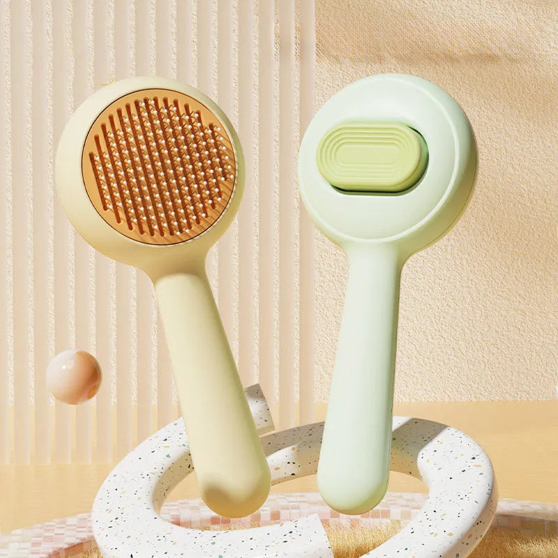 Cat grooming brush with stainless steel pins and non-slip handle in green or yellow colour