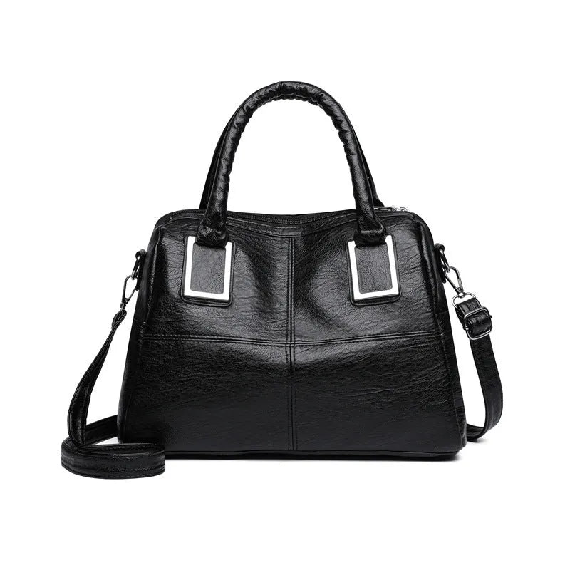 Simple square women's shoulder bag in neutral colour with internal phone and file pockets.