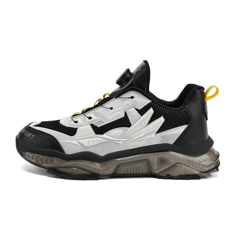 Men's black rotating button dad shoes with mesh upper and non-slip sole on wooden surface