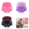 Set of three paw-shaped pet balm brushes with individual plastic storage boxes.