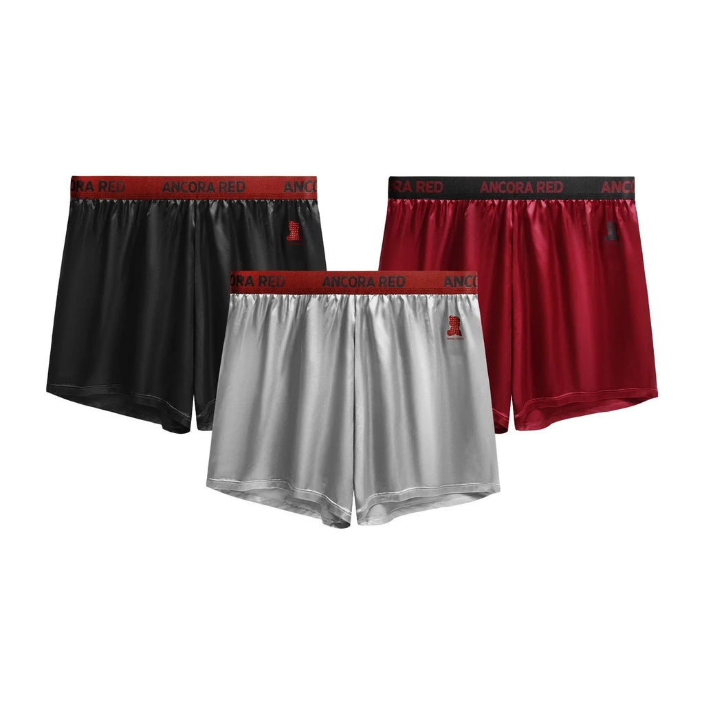 Solid colour men's boxer briefs with mid-waist design in black, red, blue, silver, purple, or brown