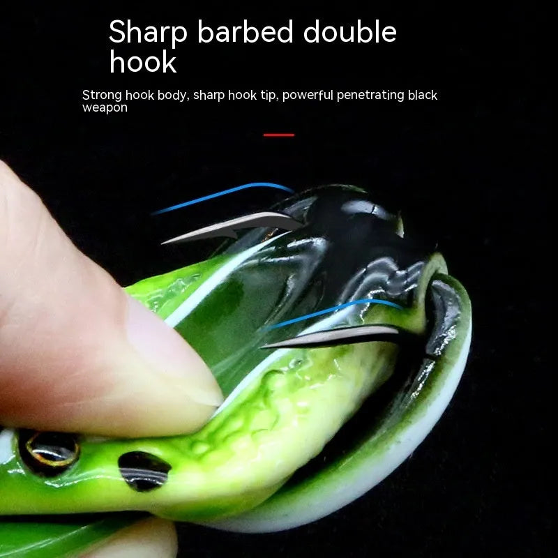Realistic frog snake head shaped soft plastic fishing lure with double hooks in grass green colour.
