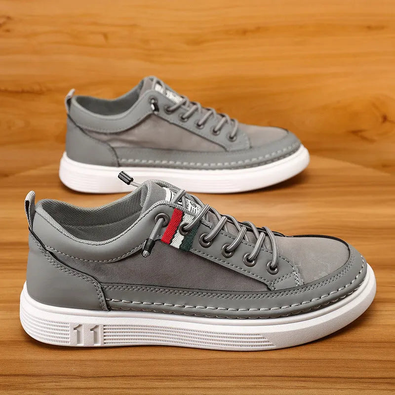 Men's grey high-top canvas bandage sneakers with a round toe on a PVC sole.