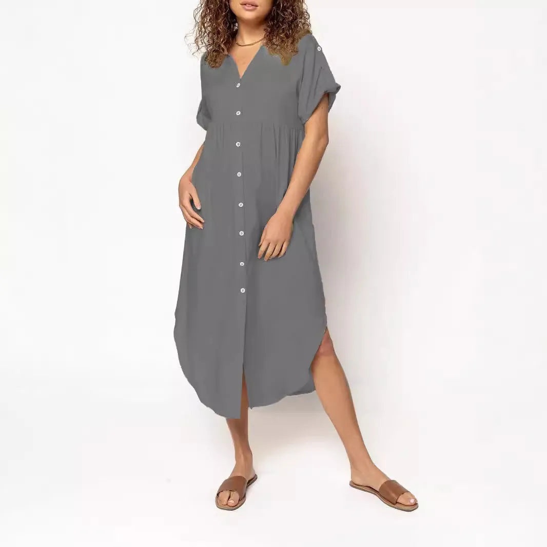 Loose-fit mid-length dress with button front in polyester fabric, available in multiple colours and sizes.
