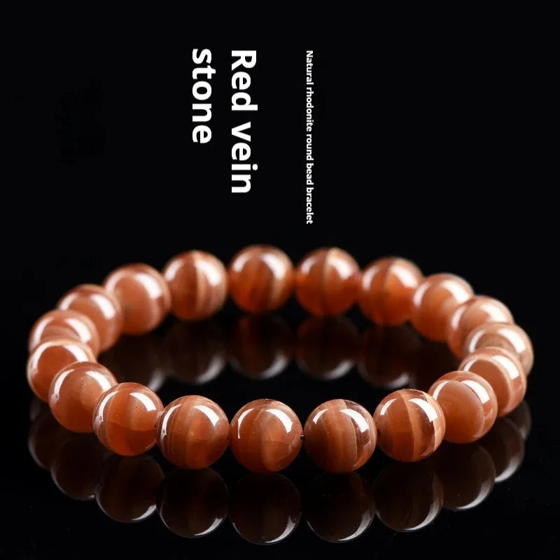 Natural rhodochrosite bracelet with round manganese spar beads and Ruyi decorative elements