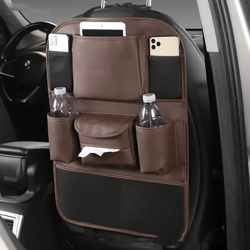 Leather car seat back storage bag in brown colour hanging over vehicle seat