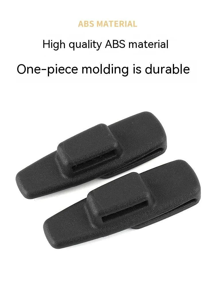 Two black ABS plastic car seat belt stopper clips with black socks in clear OPP packaging