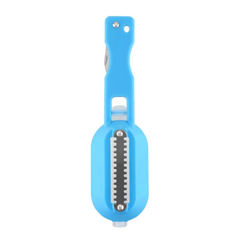 White fish-shaped kitchen scaler tool with a cover and hanging hole on handle