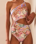 Women's rose gold patterned swimsuit on a hanger.