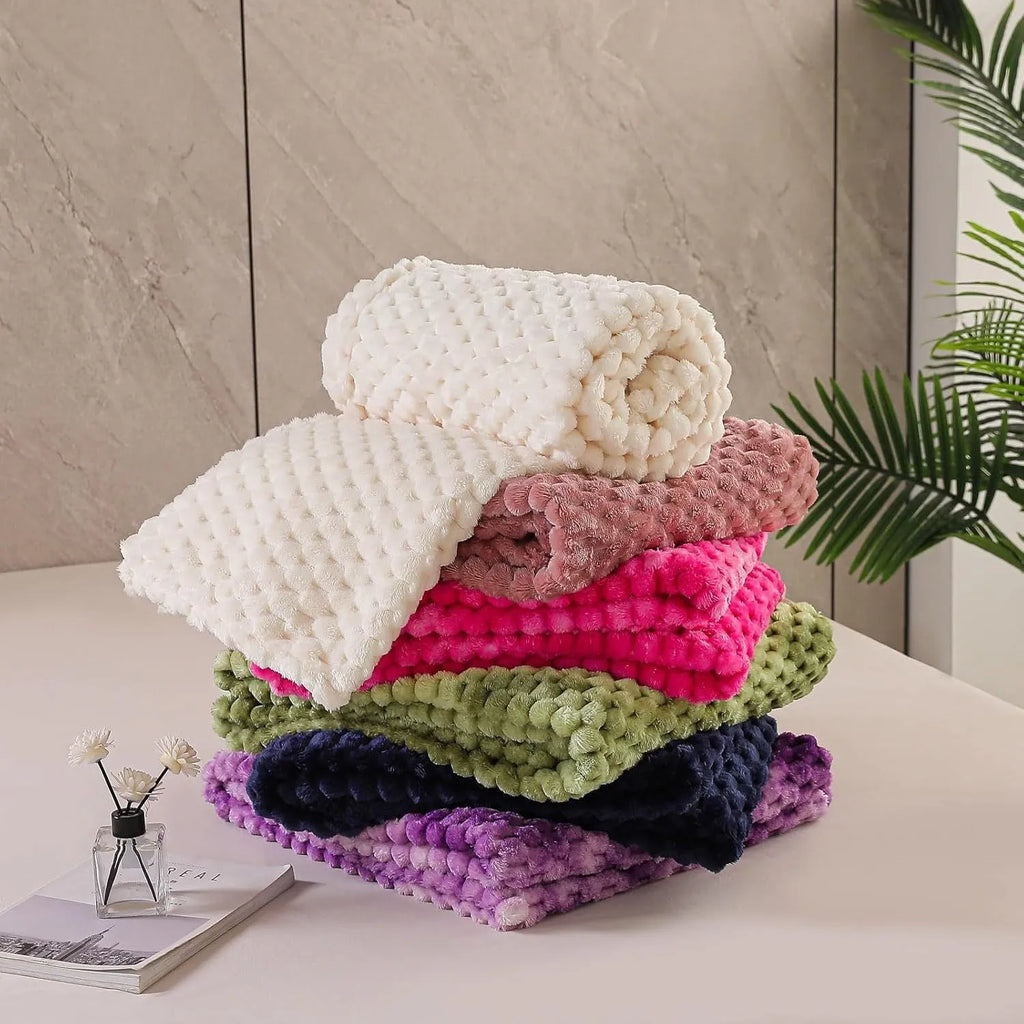 Children's plaid velvet blanket in camel colour, showing soft texture and size scale for cosy use.