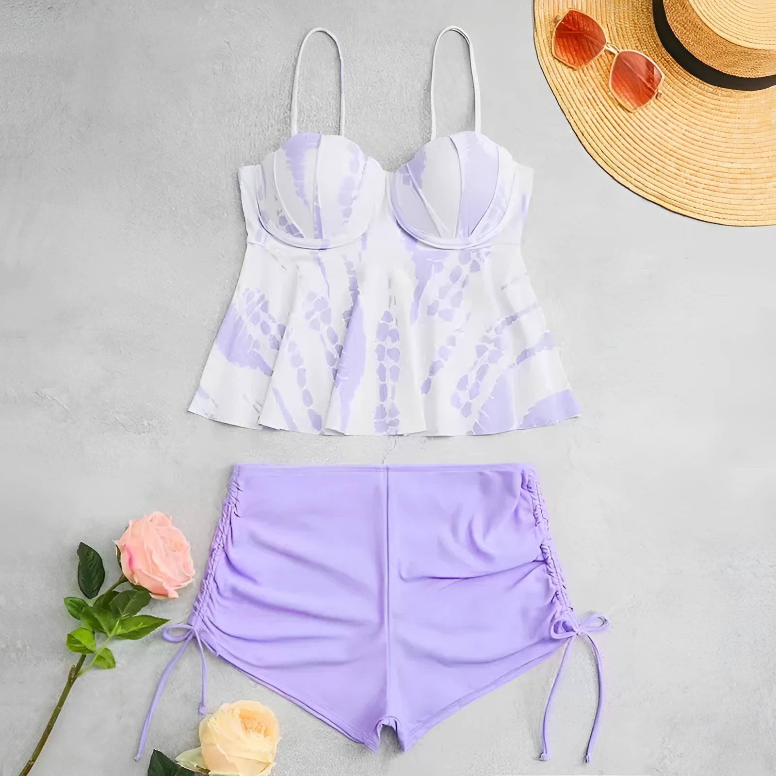 Women's printed bikini swimsuit with hard cups in blue, shown as a top and shorts set.