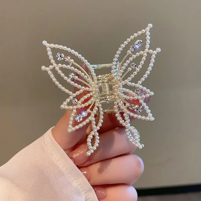 Butterfly hair barrette measuring 6.7cm x 6.2cm with electroplated alloy construction