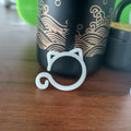 Cat-shaped plastic plant clip in green, red, white, or yellow, measuring 3cm by 4cm by 0.5cm