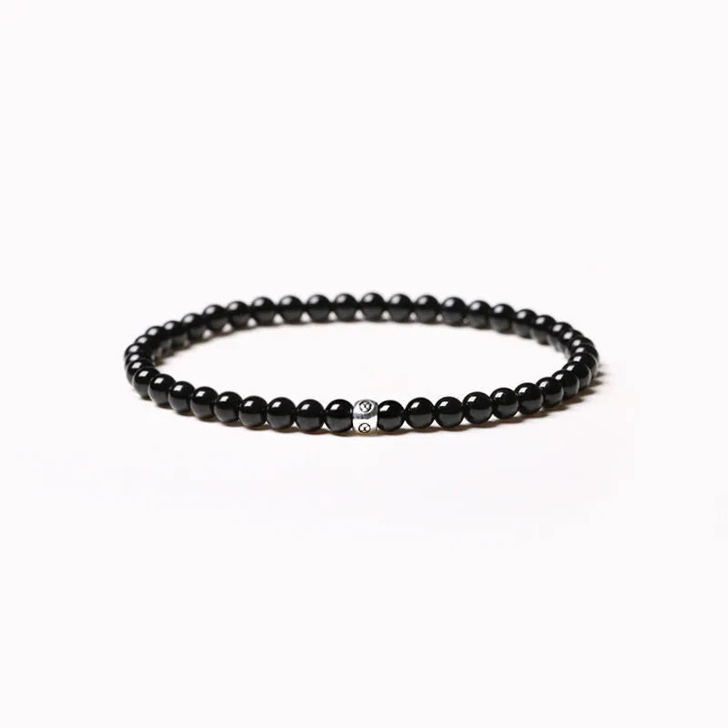 Geometric agate bracelet with round and square beads in obsidian, blue San, and black agate, 4mm size.