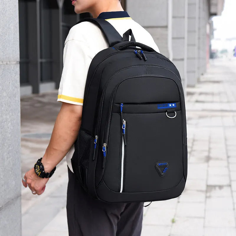 Men's large Oxford cloth schoolbag in red with air pillow belts and splicing detail.