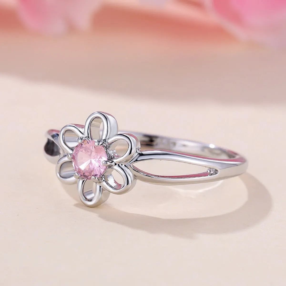 Women's copper fashion ring with hollowed flower design in platinum pink diamond colour