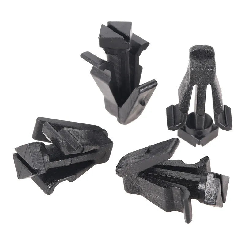Black plastic automotive fastening clip for Nissan bumper and radiator grille, part number 76882-0M060.