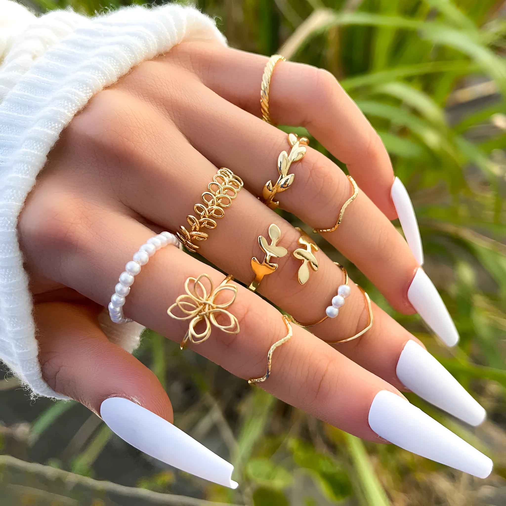 Gold openwork flower ring with delicate floral design and glossy electroplated finish