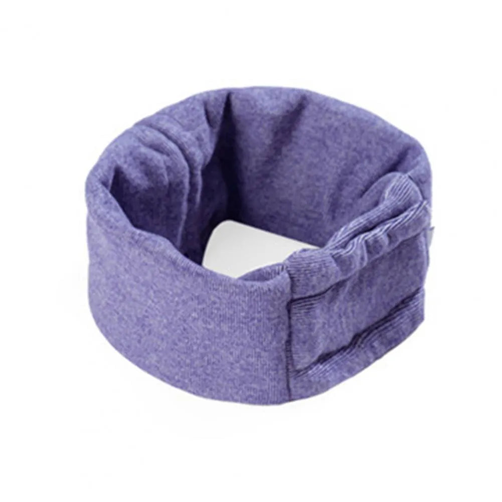 Dog wearing purple calming hoodie with ear muffs covering head and neck