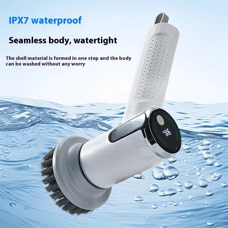 White wireless electric cleaning brush with display, Type-C port, and interchangeable brush heads on a kitchen sink