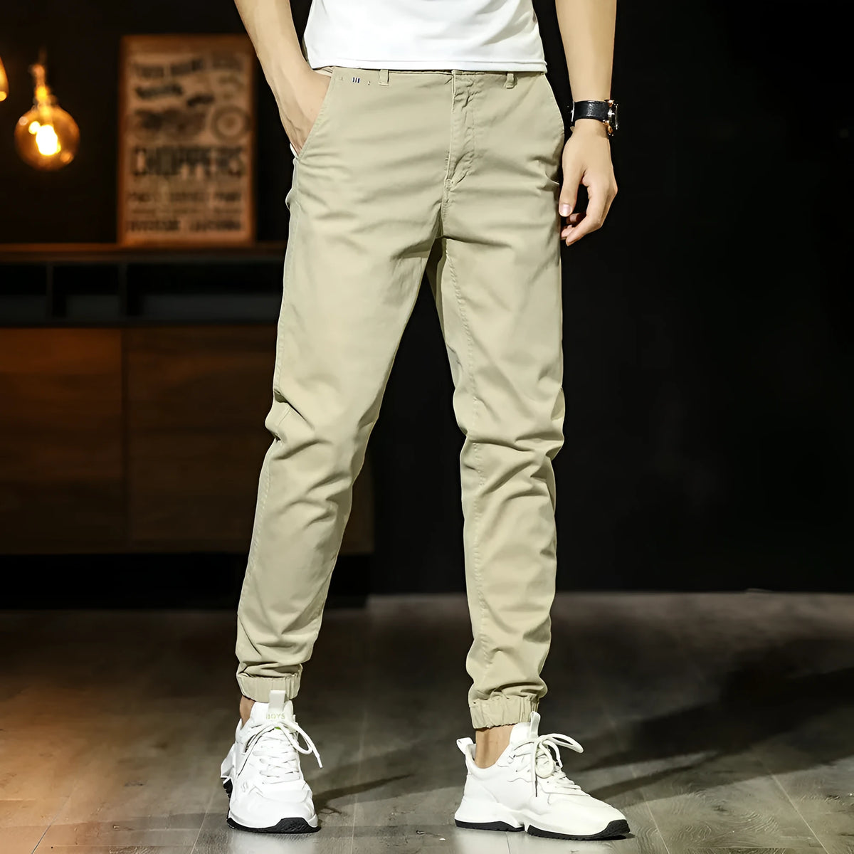 Men's cotton tapered casual trousers with ankle-tied hem, mid waist and zipper fly in khaki, black, coffee army or medium grey.