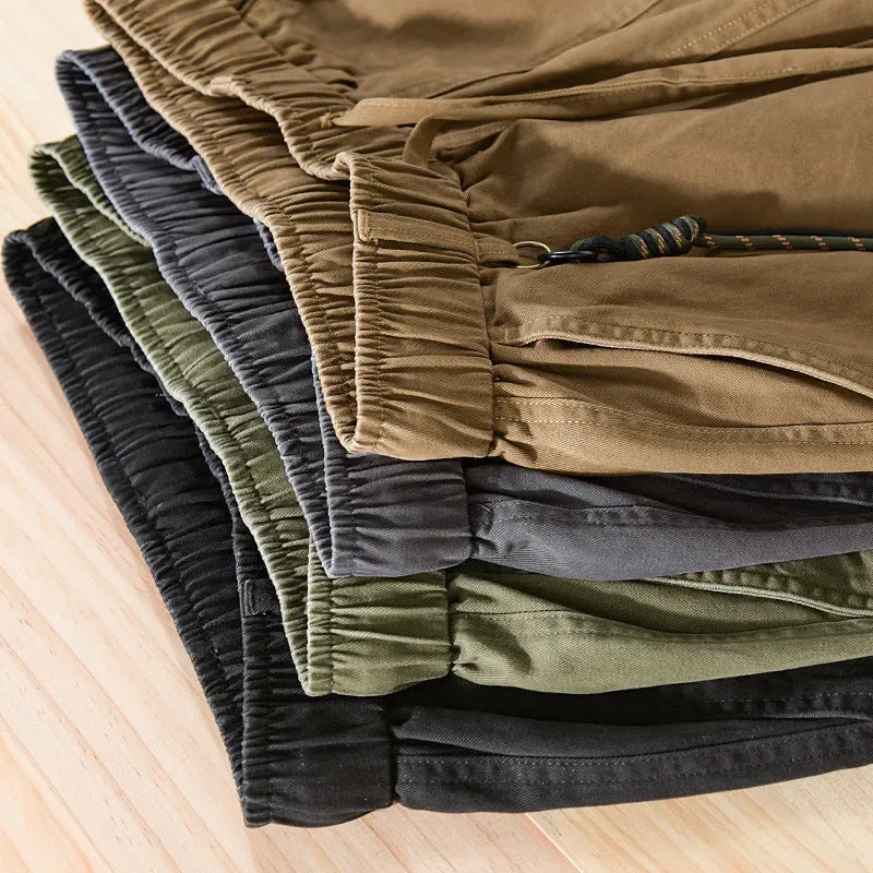 Men's cotton overalls with drawstring waist and ankle banded leg in army green colour.