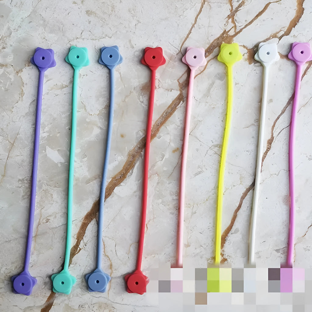 Silicone magnet cable winder wire organiser clip in assorted colours on a white background.
