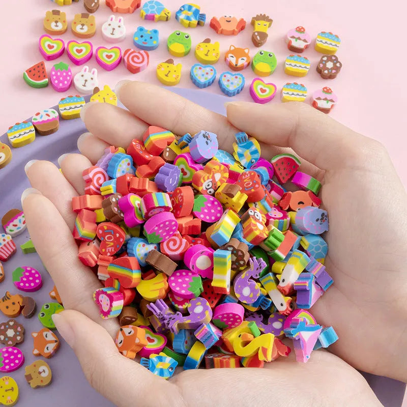 Open pearlescent film bag showing 50 small colourful cartoon fruit and theme erasers, each measuring 1-1.5 cm.