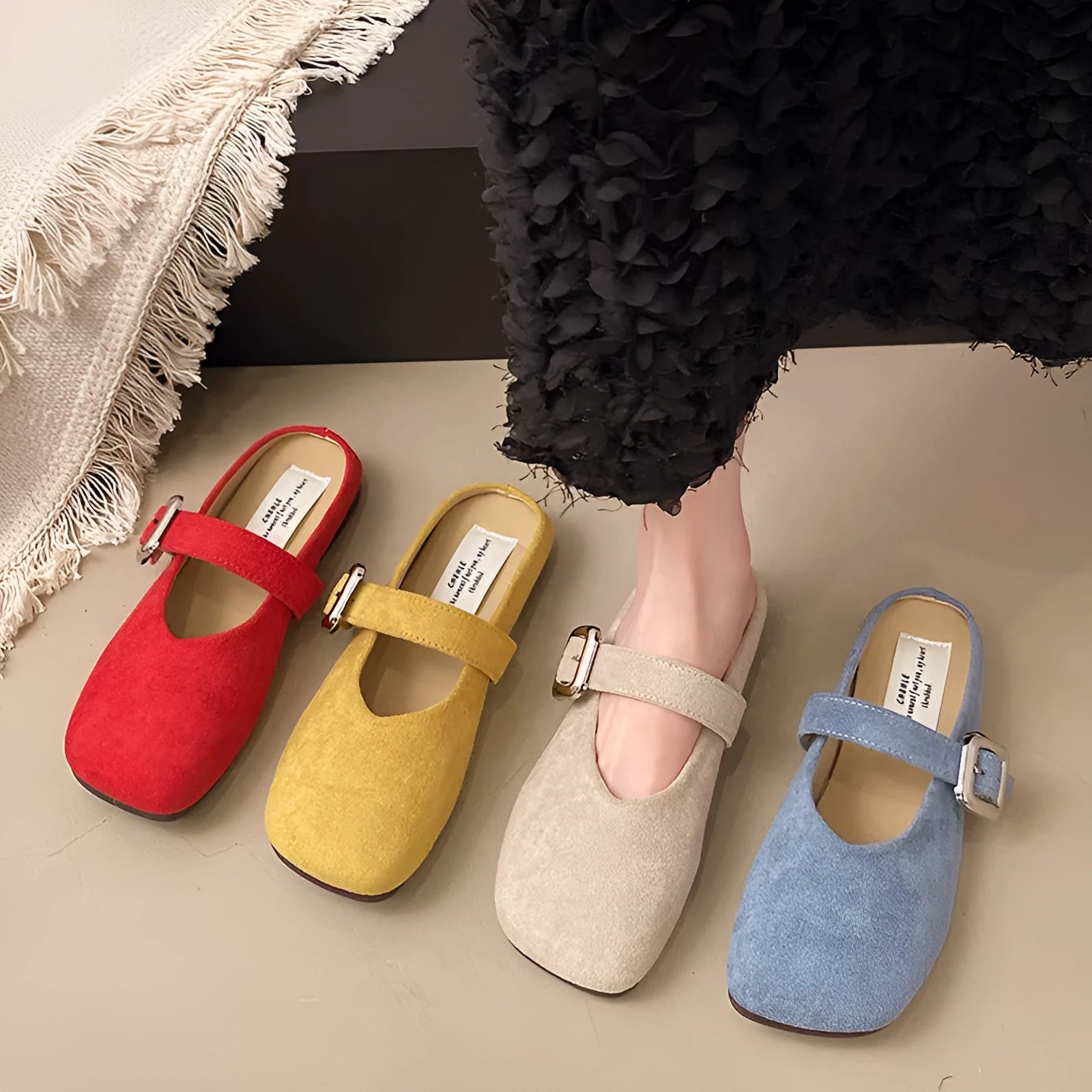 Women's flat closed-toe slippers in apricot colour with a square head design and rubber sole.