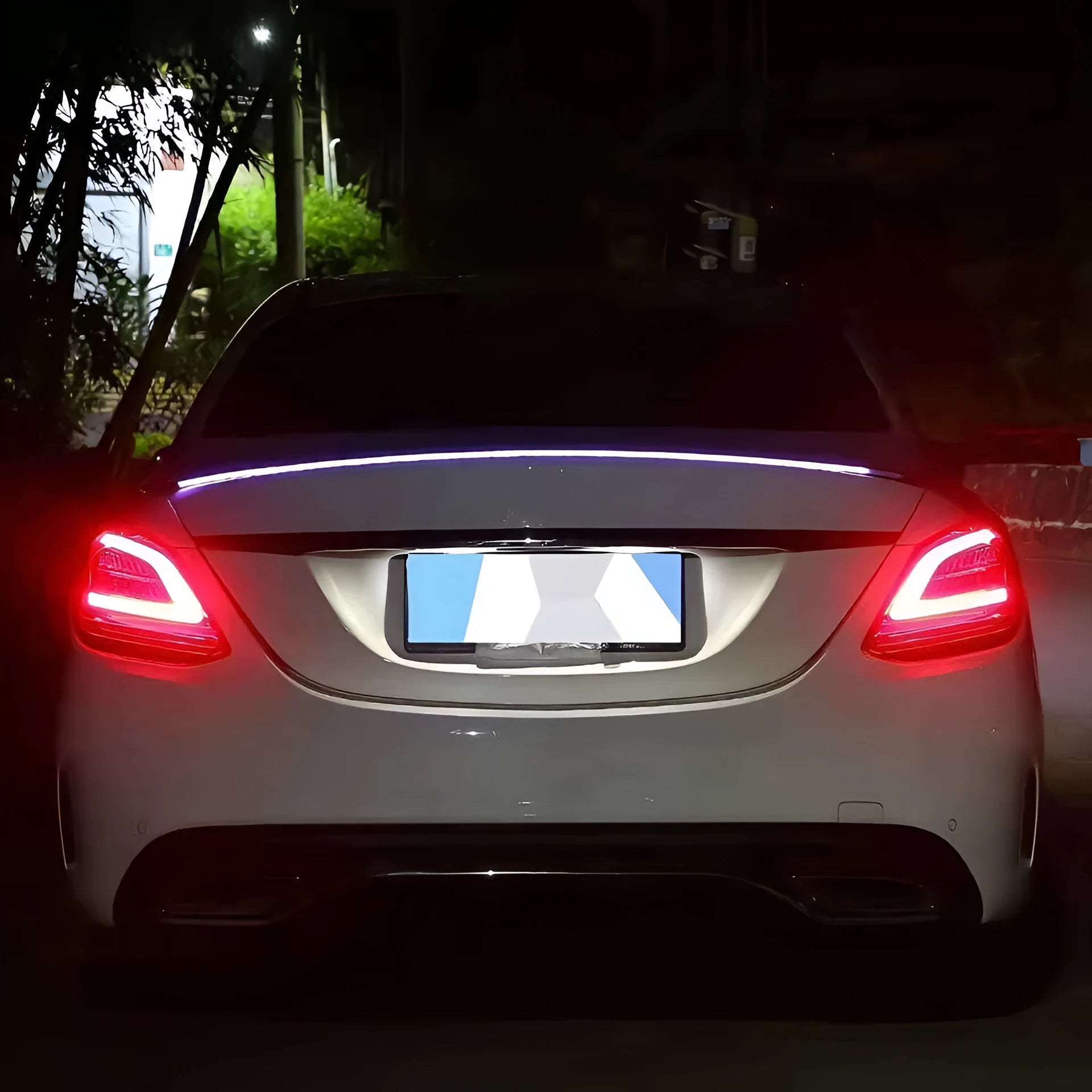 Automobile LED streamer tail wing turn signal light kit showing installation on car rear