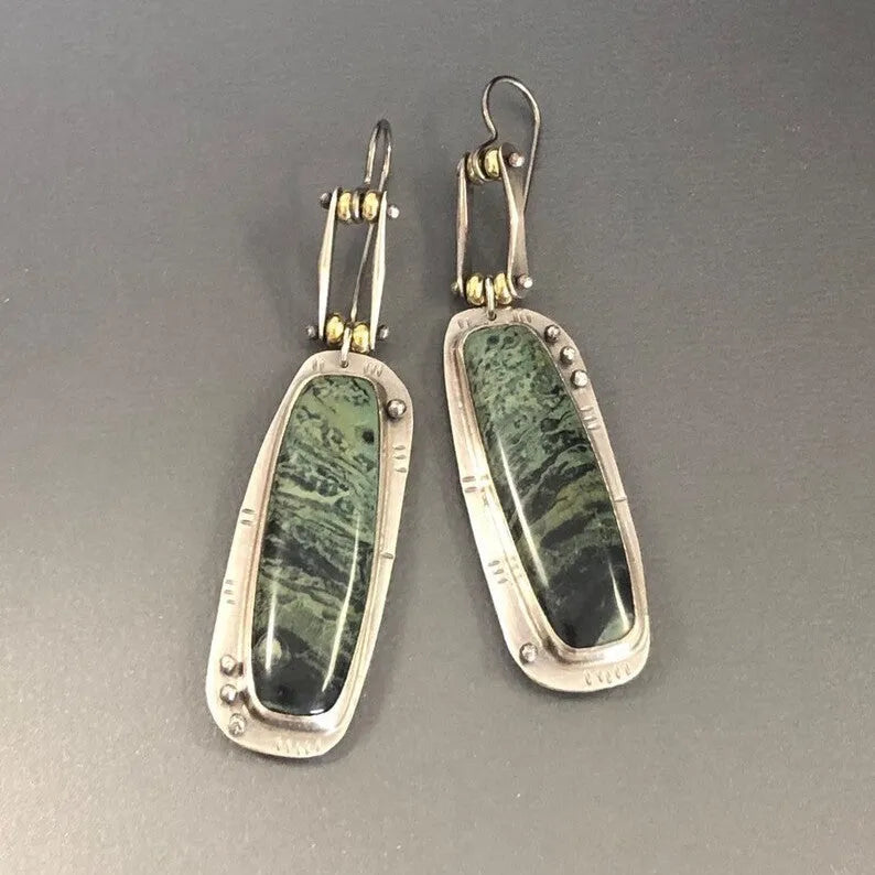Two-tone geometric marble pattern earrings with alloy construction and post back closure