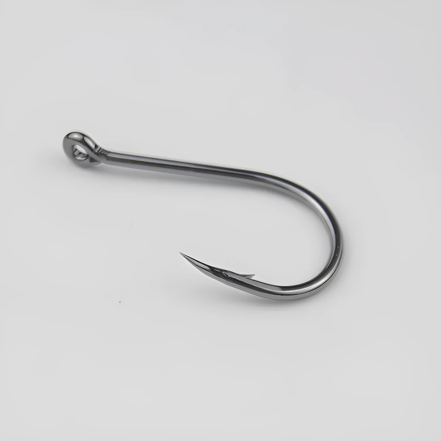 Bulk pack of barbed crooked mouth fishing hooks for sea fishing, made from alloy carbon steel.
