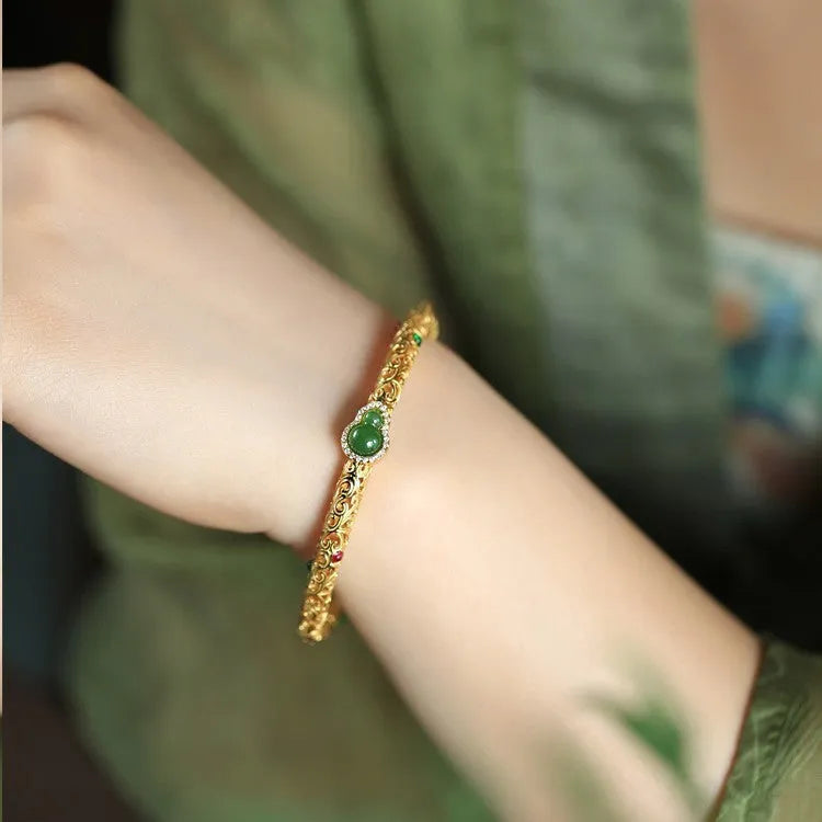 Women's gold-plated bracelet with xiangyun gourd charm and retro opening clasp on copper construction
