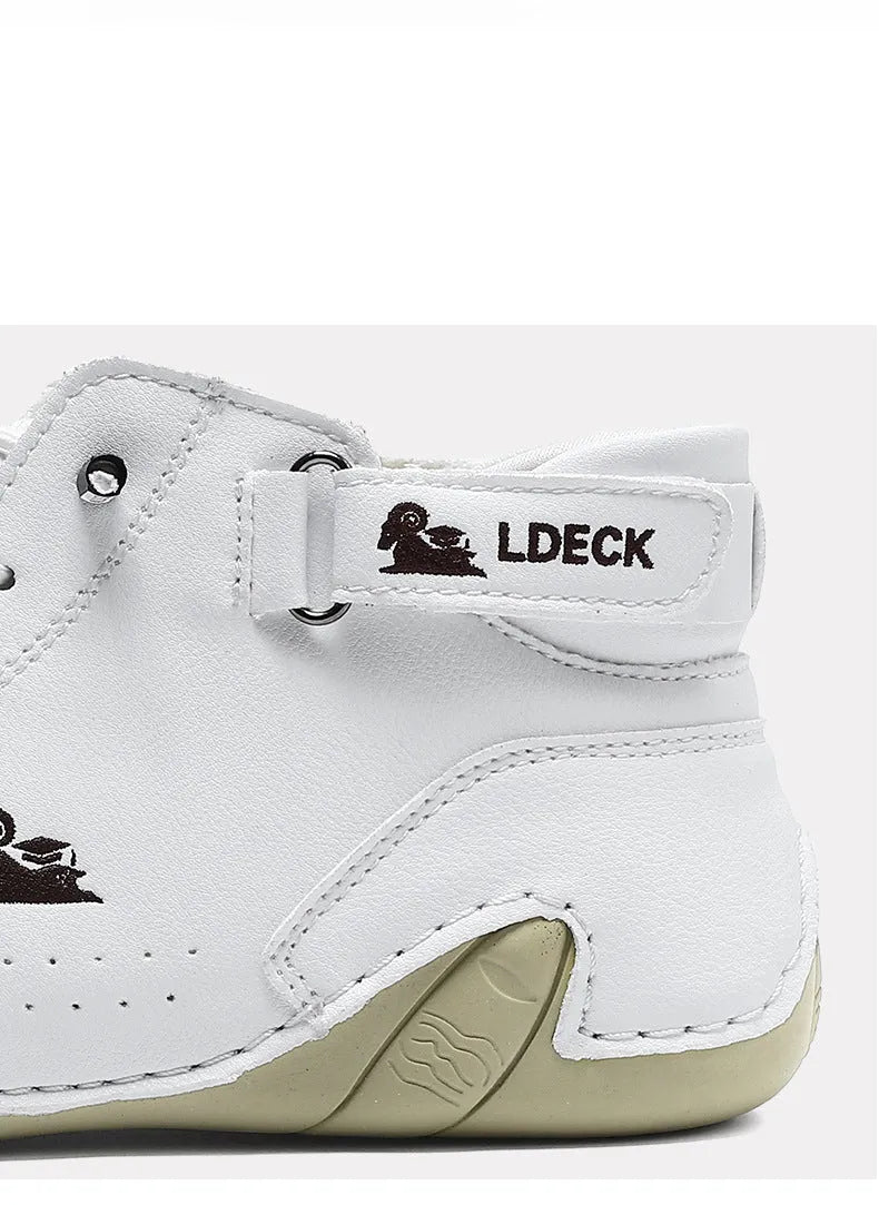 High top men's shoes in khaki with rubber soles and microfiber uppers, showing round toe and pigskin boot tube