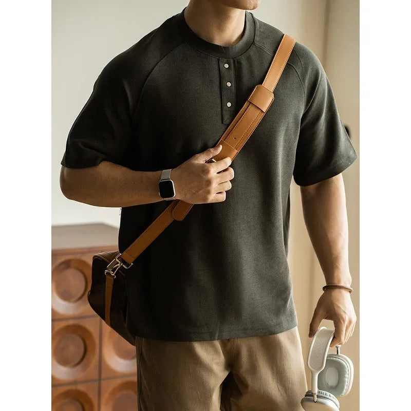 Casual pullover top with raglan sleeves in terry texture fabric showing loose fit and colour options
